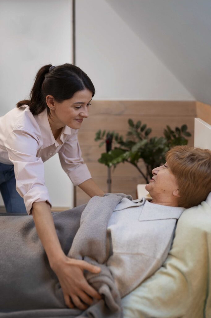 female nurse taking care elderly person